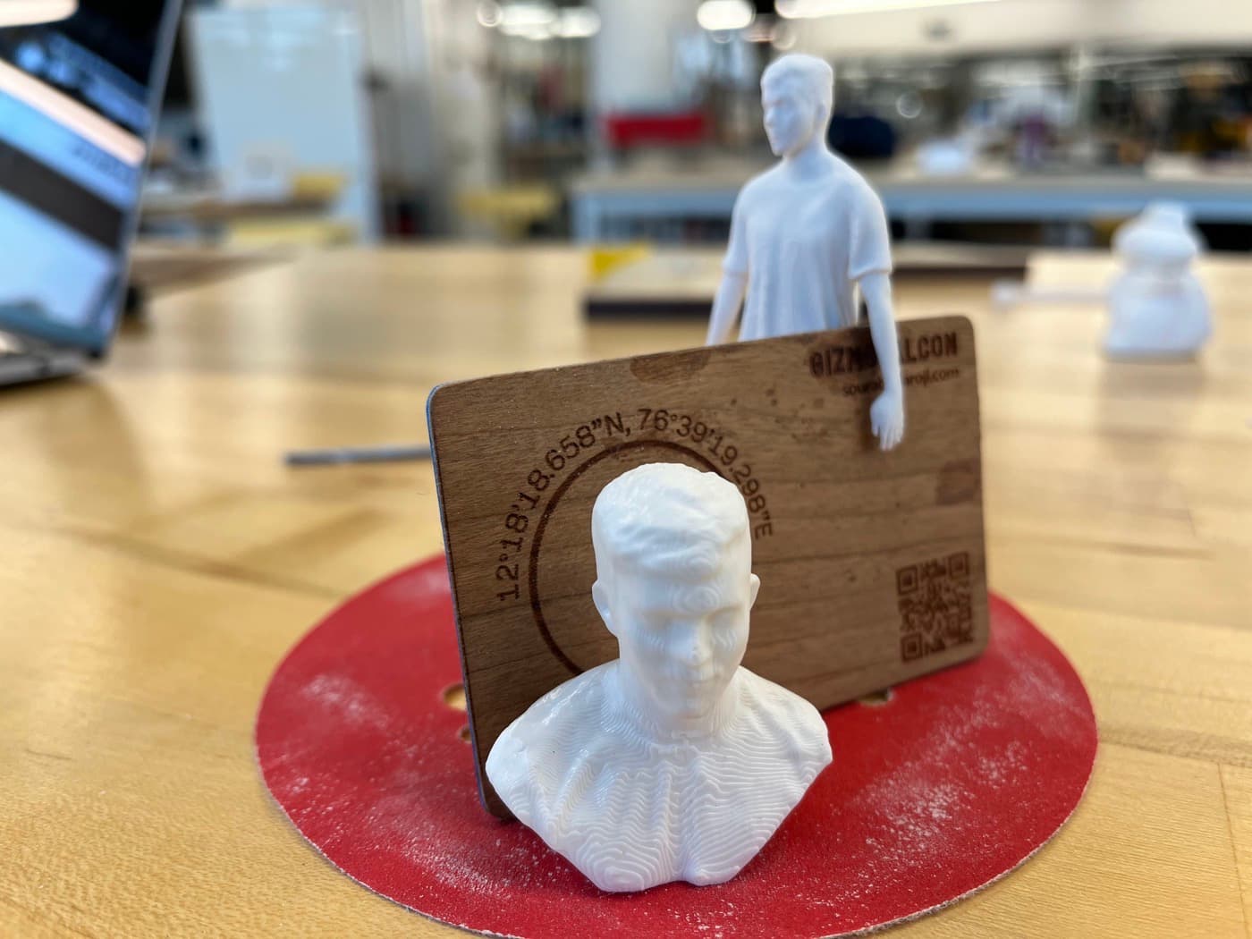 3D printed bust with the laser etched card in the background